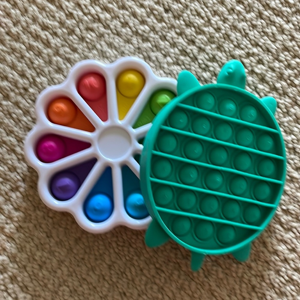 2 fidgets one dimpl and one pop it